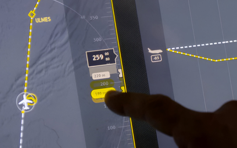 Porject picture man using large touch screen in a cockpit