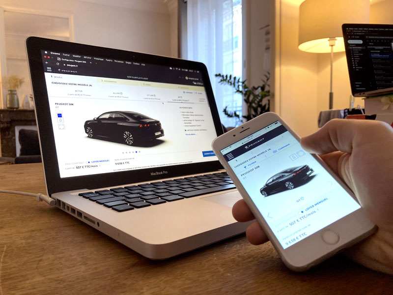 Car configurator laptop phone aside