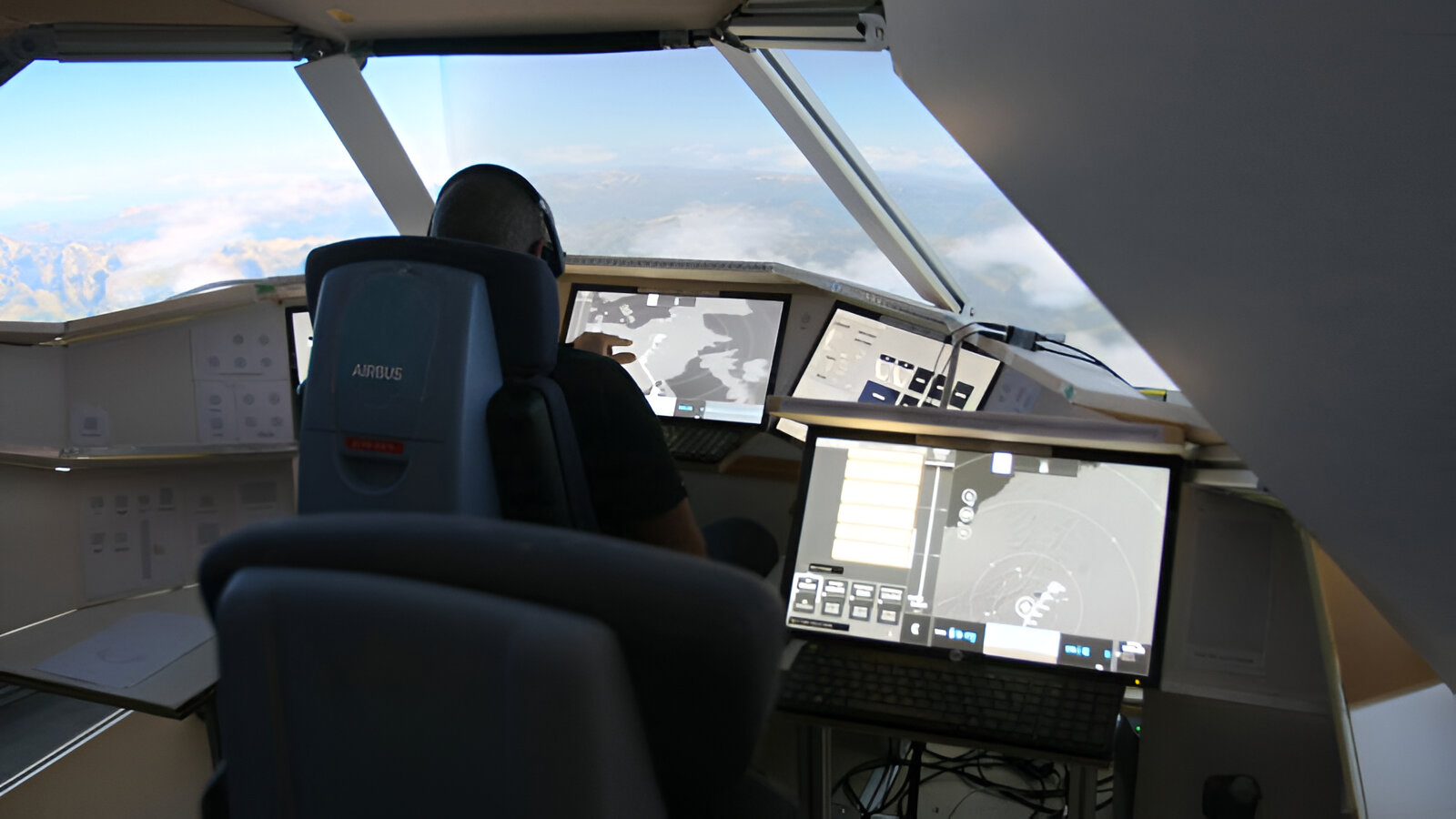 user in cockpit using touchscreens