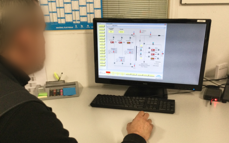 User research observation, technician using computer control room